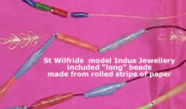 Jewellery modelled from rolled strips of paper